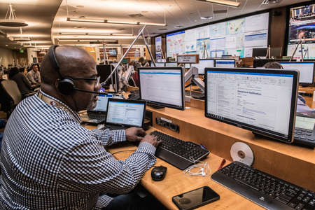 A black African American men working on his computer at office. This picture was taken at New York...
