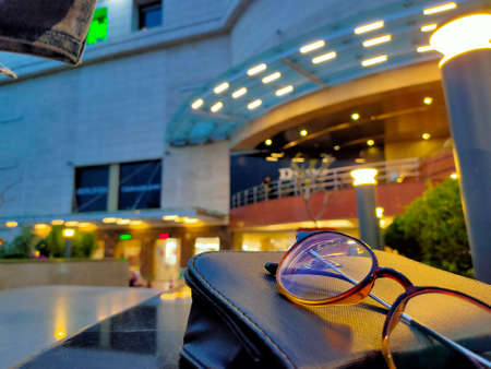 Reading glasses & a ladies purchase at out site of shopping mall. This image was taken at vasant...