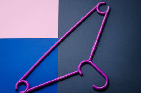 Clothes hanger on multi color background. copy space.flat layの写真素材