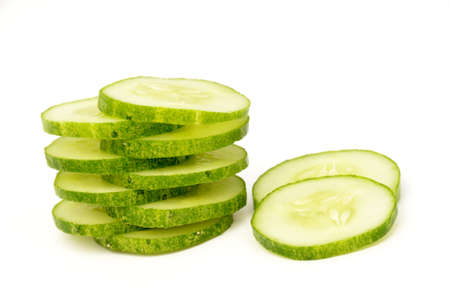 sliced cucumber isolated on white background.の写真素材