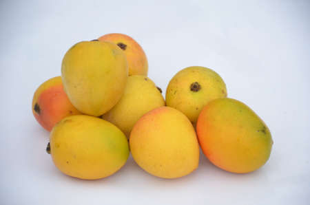 bunch the red yellow mango isolated in white backgroundの写真素材