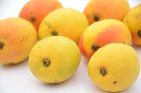 bunch the red yellow mango isolated in white backgroundの写真素材