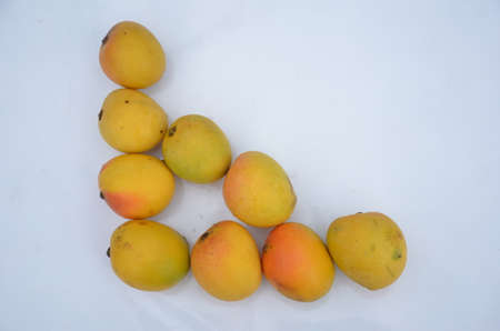 bunch the red yellow mango isolated in white backgroundの写真素材