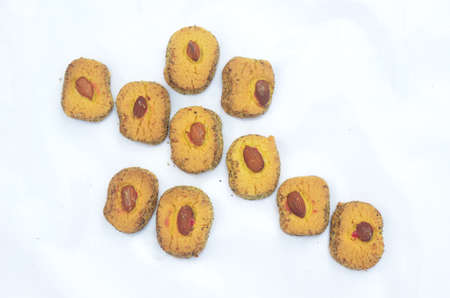 the yellow biscuit with almond isolated on white background.の写真素材