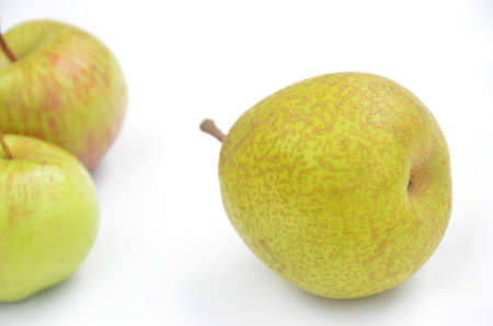 the green ripe pear with apple isolated on white background.の写真素材