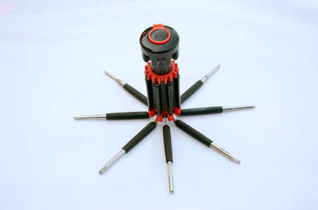 the old black red screw driver isolated on white background.の写真素材