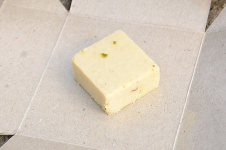 the brown color condensed milk sweet isolated on grey background.の写真素材