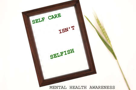 self care is n't selfish concept mental health awareness with green plant on the white background.の写真素材