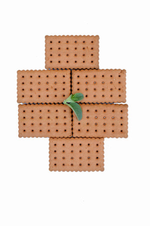 closeup the bunch brown biscuit with green mint on the white background.の写真素材