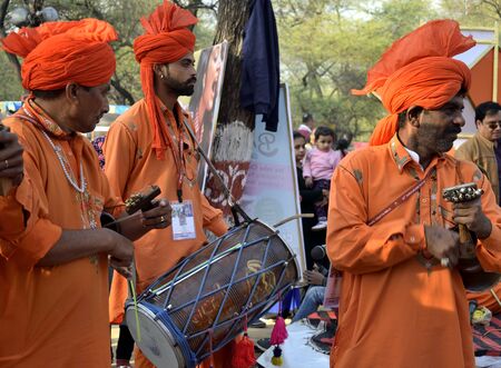 Faridabad, Surajkund, India, February 2019 : 33 Surajkund International Crafts Mela, artist playing...