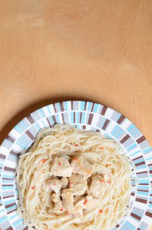 Pasta with meat with slices of red pepperの写真素材