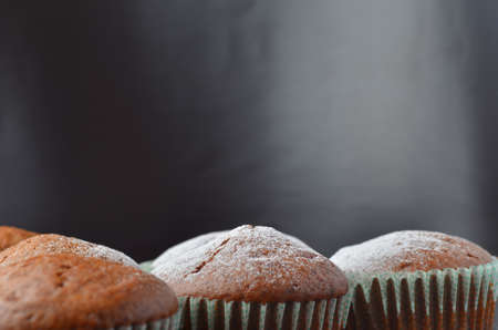 Homemade chocolate muffins with caster sugarの写真素材