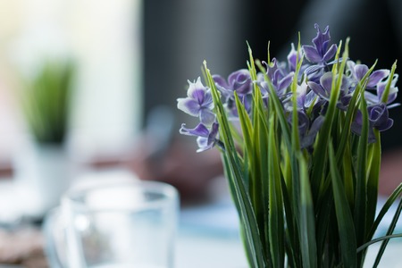 Bouquet of blue flowers on a table in the officeの写真素材