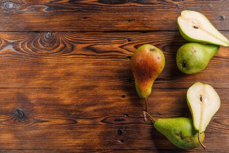 Fresh pears on the wooden background with free space for text. Top viewの写真素材