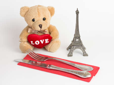 Teddy bear, Eiffel Tower and cutlery for valentines dayの写真素材