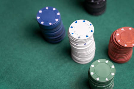 Stack of chips and green mat. Poker game concept