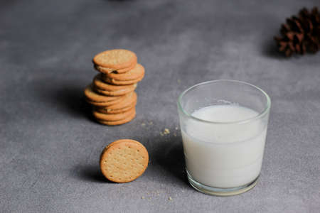 a glass of milk and biscuits for a healthy breakfast. suitable for diet program.の写真素材