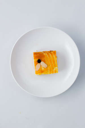 Lekkker Holland cake served with slices. The cake's real name is Dutch Buttercake or Boterkoek.の写真素材