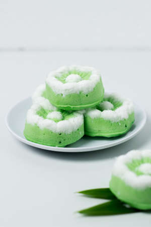 Putu Ayu traditional Indonesian cake. The cake is green with the aroma of pandan and grated coconut topping.の写真素材