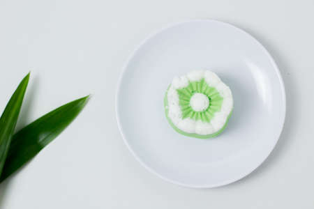 Putu Ayu traditional Indonesian cake. The cake is green with the aroma of pandan and grated coconut topping.の写真素材