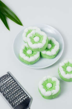 Putu Ayu traditional Indonesian cake. The cake is green with the aroma of pandan and grated coconut topping.の写真素材