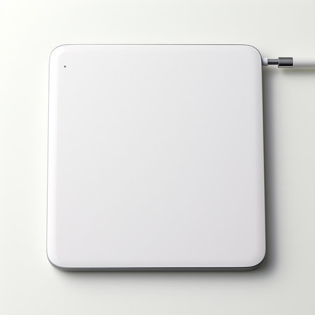 3d rendering of a laptop with external hard drive on white backgroundの素材