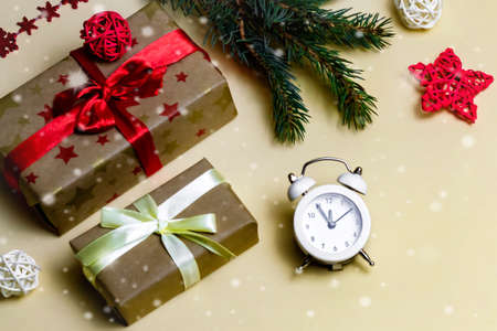 New year concept time to buy gifts flat lay close-up on light yellow background.