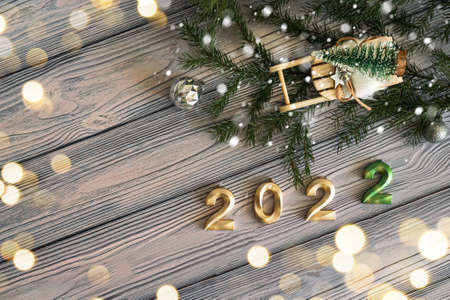 It's time for New Year's greetings. Postcard with copy space on light wooden background, christmas...