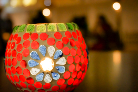 Table lamp decorated with glass work, used to house a candle  May be used in contexts that need a decorative ornament depicting diwali, christmas or halloweenの写真素材