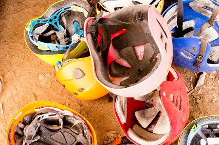 scratched safety helmets used for mountaineering and other adventure sportsの写真素材