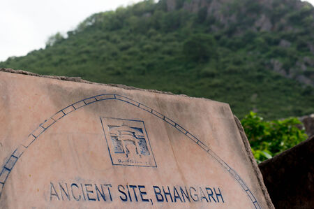 Sign or Plaque marking the entry point for the famous haunted city of Bhangarhの写真素材