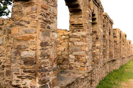 Series of ruined stone arches in the famous haunted city of Bhangarh  India   This was the johri baazar  Jwellers market  of the cityの写真素材