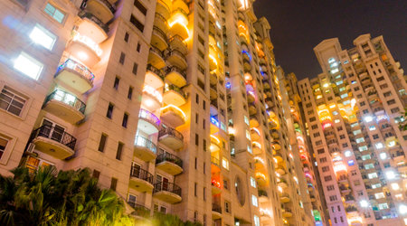 High rise apartments in Gurgaon India beautifully lit up for the festival of diwali. The developement of Gurgaon has seen the construction of a number of skyscrapers for housingのeditorial素材