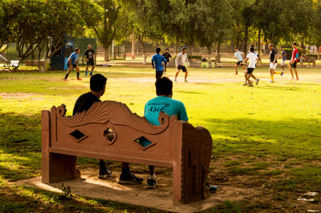 Gurgaon India  23rd May 2015: Spectators watching a informal game of football between some people in Gurgaon India.のeditorial素材