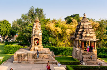 Khajurao, India, 6th Dec 2015: Smaller temples flank the main temples in the UNESCO heritage site in Khajuraoのeditorial素材
