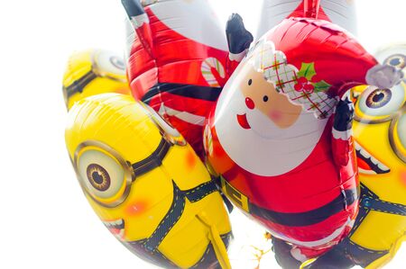 Santa and minions baloons isolated. These are very popular during the christmas timeの写真素材