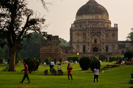 Delhi, India, 8th Nov'15: People playing in front of the ruins of Lodhi Garden in Delhi. The grounds...