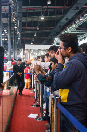 DELHI, INDIA 6TH FEB 2016: Crowd of young men and women photographing the displays