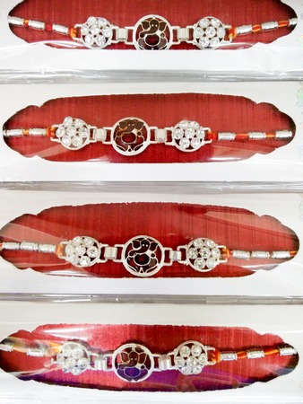Indian rakhi threads packed for purchase. The festival symbolizes the brother sister love and the brother's protection of his sisterの写真素材
