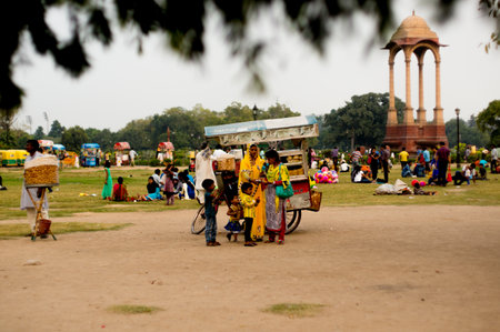 Delhi, India - 24th Sept 2016 : Families enjoying a weekend picnic near India Gate Delhi. This is a popular place for tourists with street food and large open groundsのeditorial素材