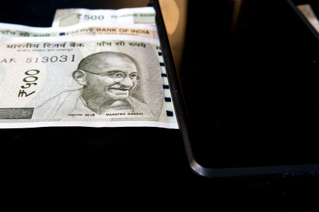 With the ban of currency notes in Demonitization people have moved more to electronic methods of payment via mobile phonesの写真素材