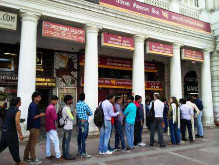 Delhi, India - 26th Nov 2016: People stand in a queue outside a bank ATM in Connaught Place Delhi...