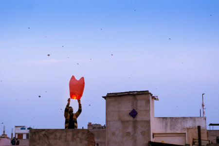 Jaipur, India - 14th Jan 2017: People release a chinese lantern into the air as part of Makar Sankranti or Uttaryan celebration in Rajasthan India. This is a recent trendのeditorial素材