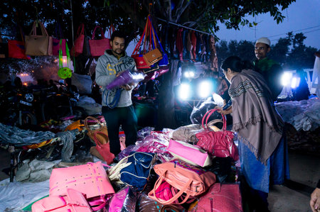 Delhi, India - 28th Jan 2017: Street market in Chandni Chowk near red fort at night. Open shops perfect for low budget items.のeditorial素材