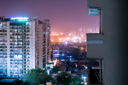 Noida, India - 4th April 2017: Antriksh nature apartment building at night. Apartments are getting very popular owning to the huge population increaseのeditorial素材