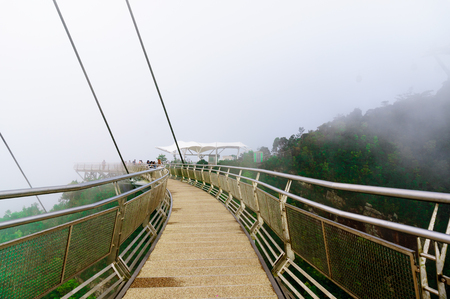 Empty suspension bridge disappearing off into the distance in Langkawiの写真素材