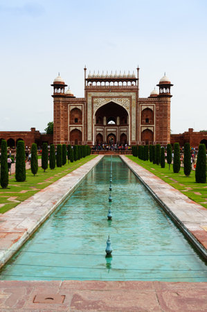 Agra, India - 12th Aug 2017: Crowds roam on the path leading to the entry gate for the Taj Mahal complex. The beautiful mughal architecture is evident with the arched gate and canopiesのeditorial素材