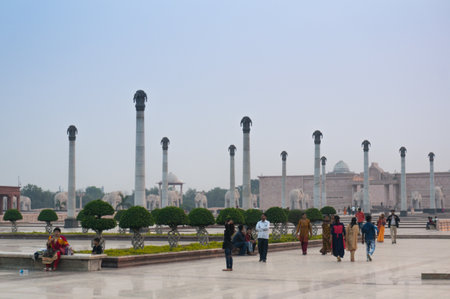 Families walk past the pillars at Ambedkar Parkのeditorial素材