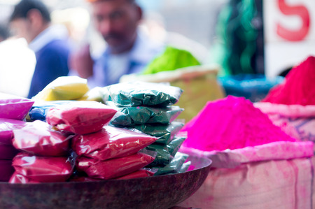Piles and packets of gulaal color for indian festival of holiの写真素材