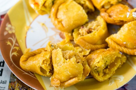 Closeup shot of cut gujiya , sweet filled delicacy served on holi and diwali